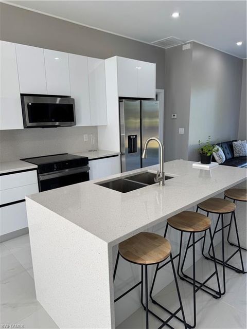 Single Family Residence in LEHIGH ACRES FL 605 Highland AVE.jpg