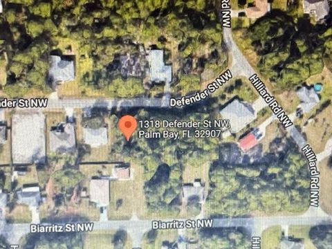 Single Family Residence in Palm Bay FL 1312 Defender Street.jpg