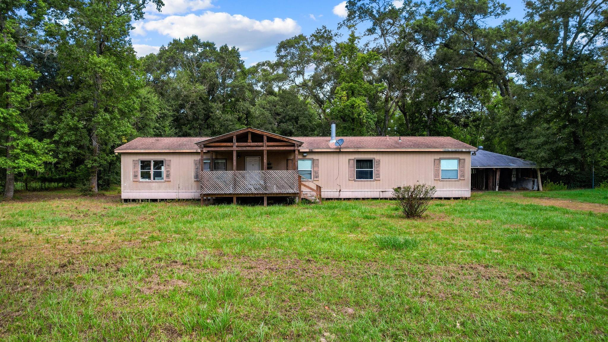 863 County Road 3141 E, Cleveland, TX 77327 photo