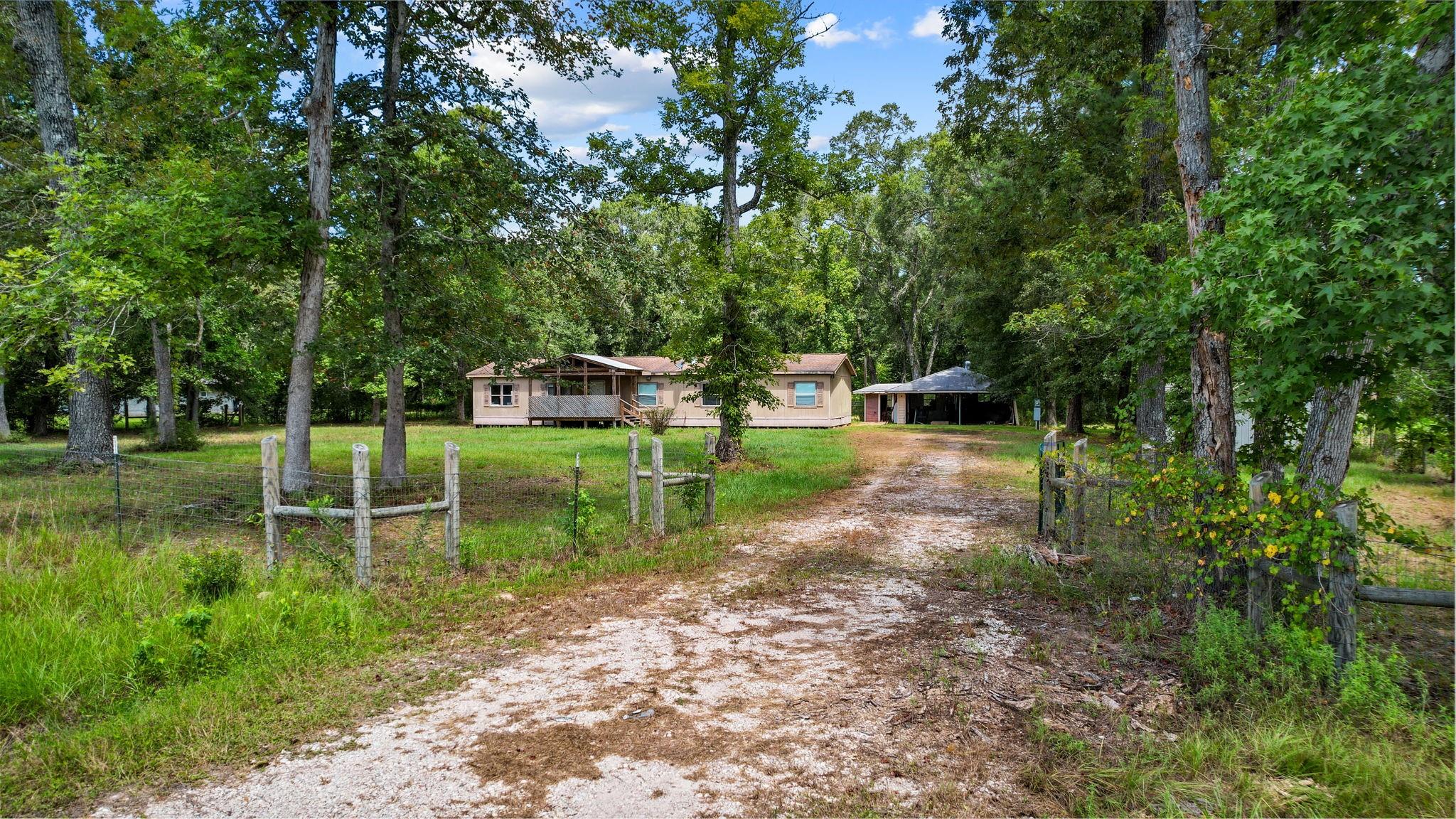 863 County Road 3141 E, Cleveland, TX 77327 photo