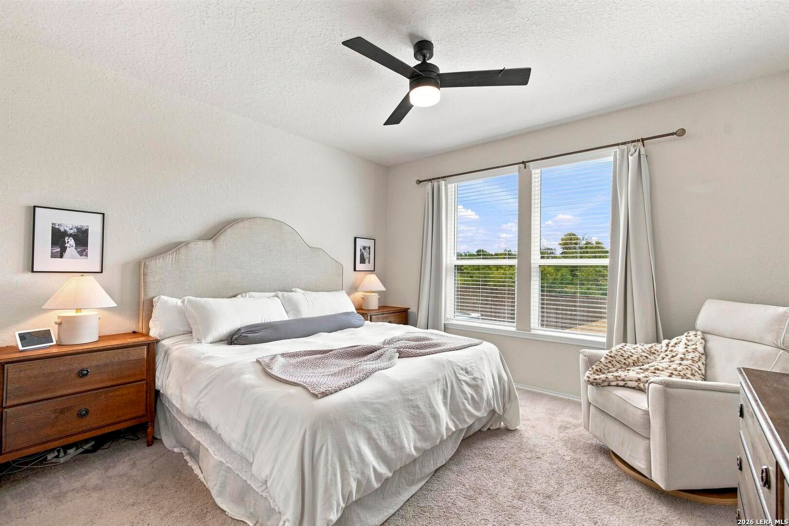 Primary bedroom with large rear-facing windows