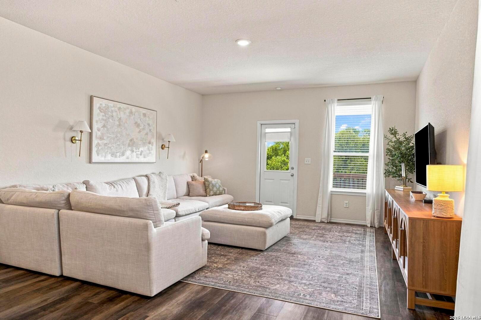 Living room with rear door and window