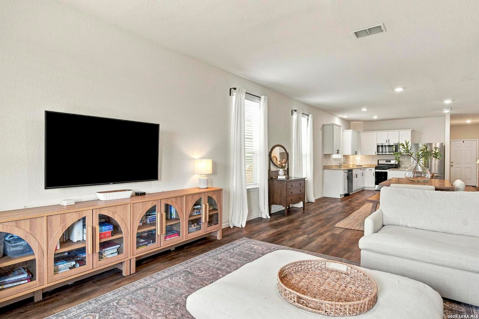Open living area looking toward the kitchen and dining space