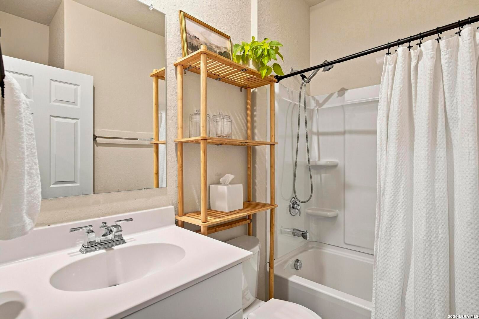 Secondary bathroom with tub and shower