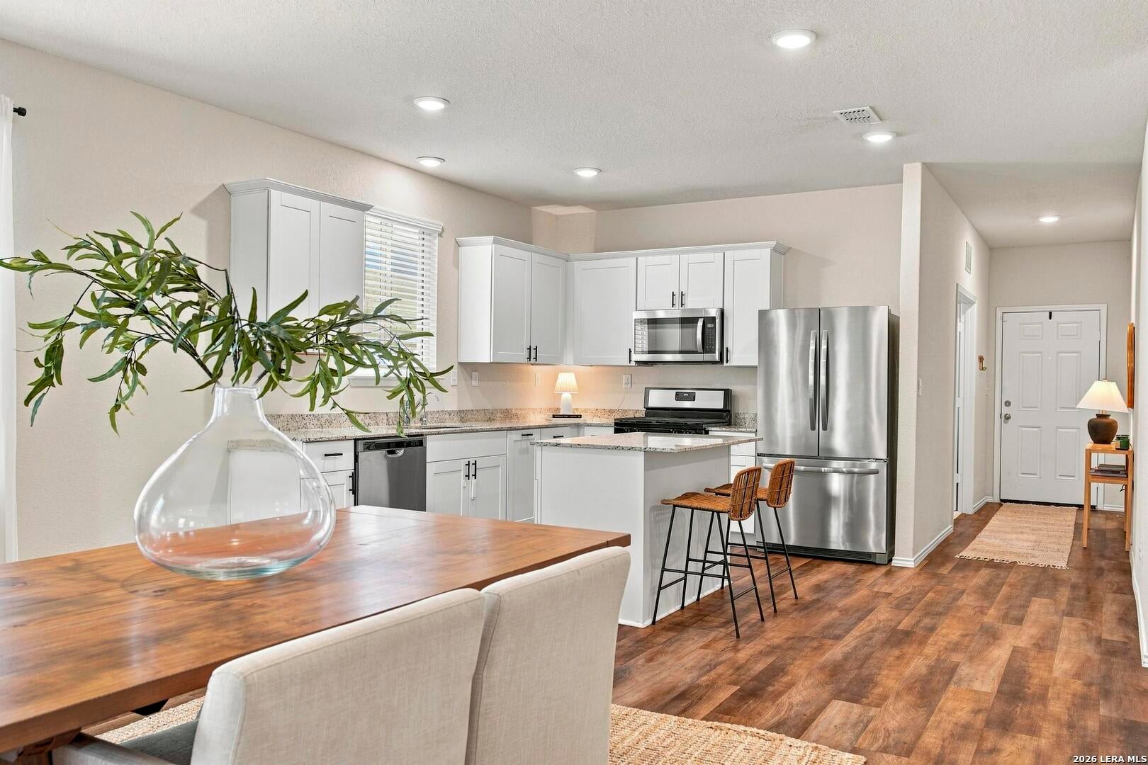Kitchen and dining area viewed from the living space