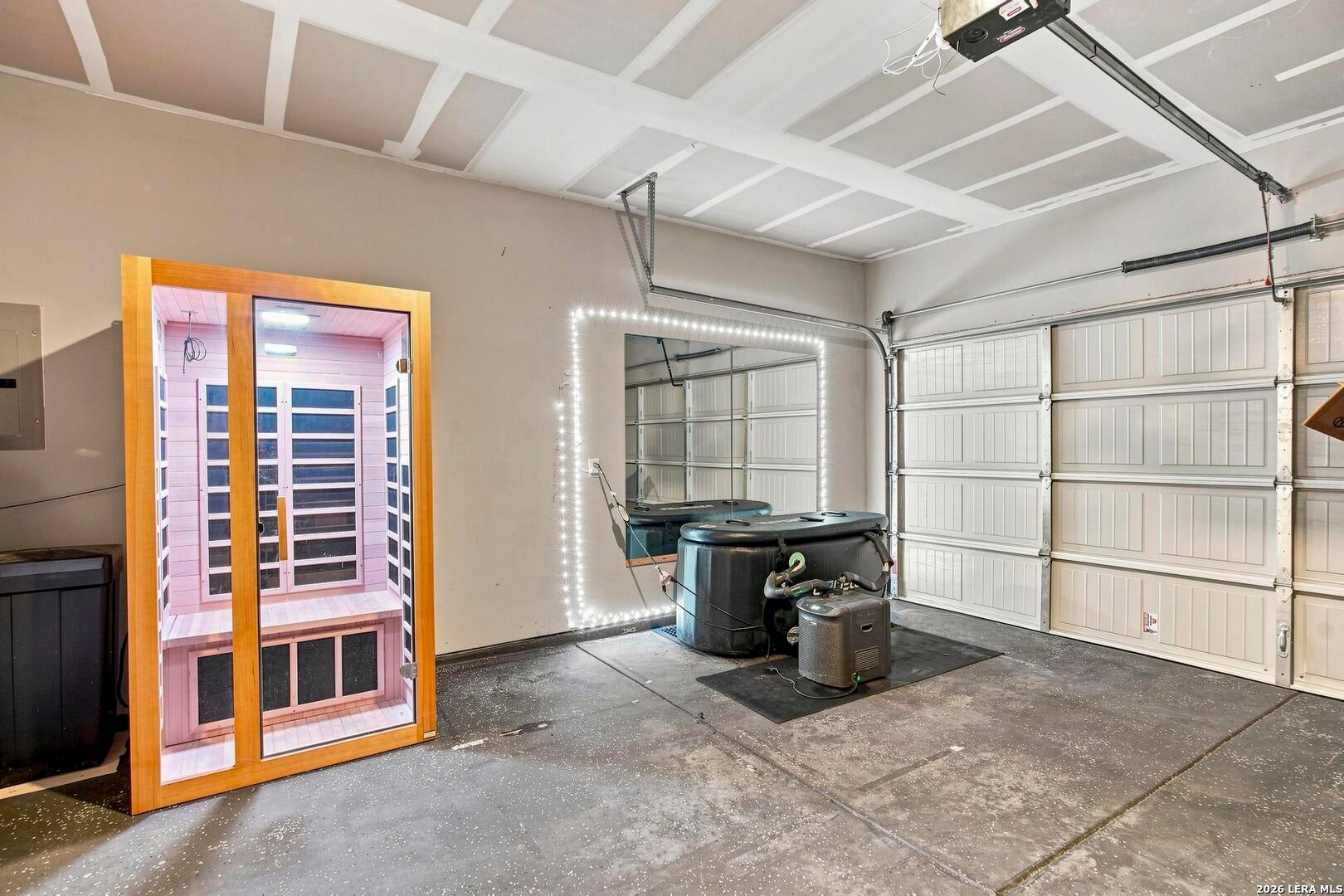 Garage wellness setup with sauna and cold plunge