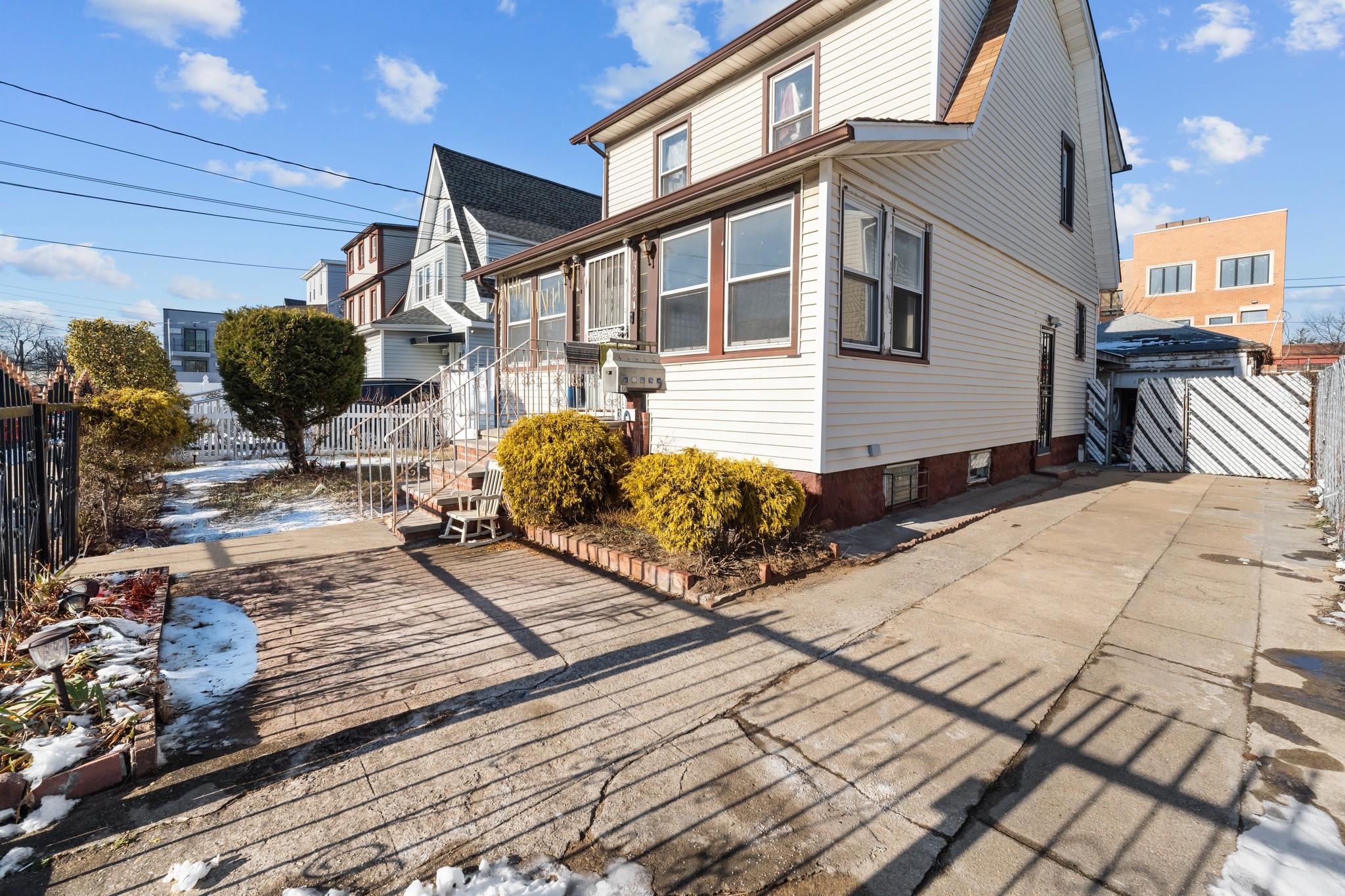 Single Family Residence in Springfield Gardens NY 13121 Mathewson Court 1.jpg